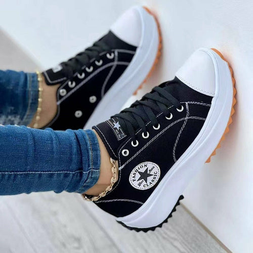 Flat lace-up canvas sneakers, front view