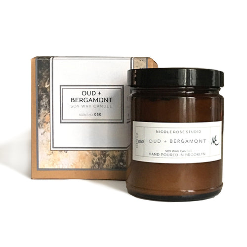 Oud and bergamot soy wax candle jar close-up