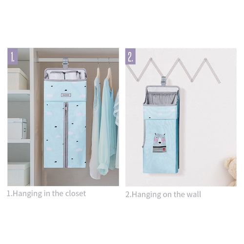 Baby crib organizer hanging on crib rail